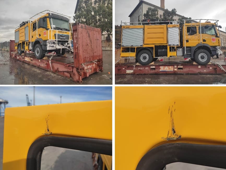 Yellow industrial truck with damaged rear door and broken window